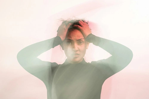Holding head in confusion and frustration